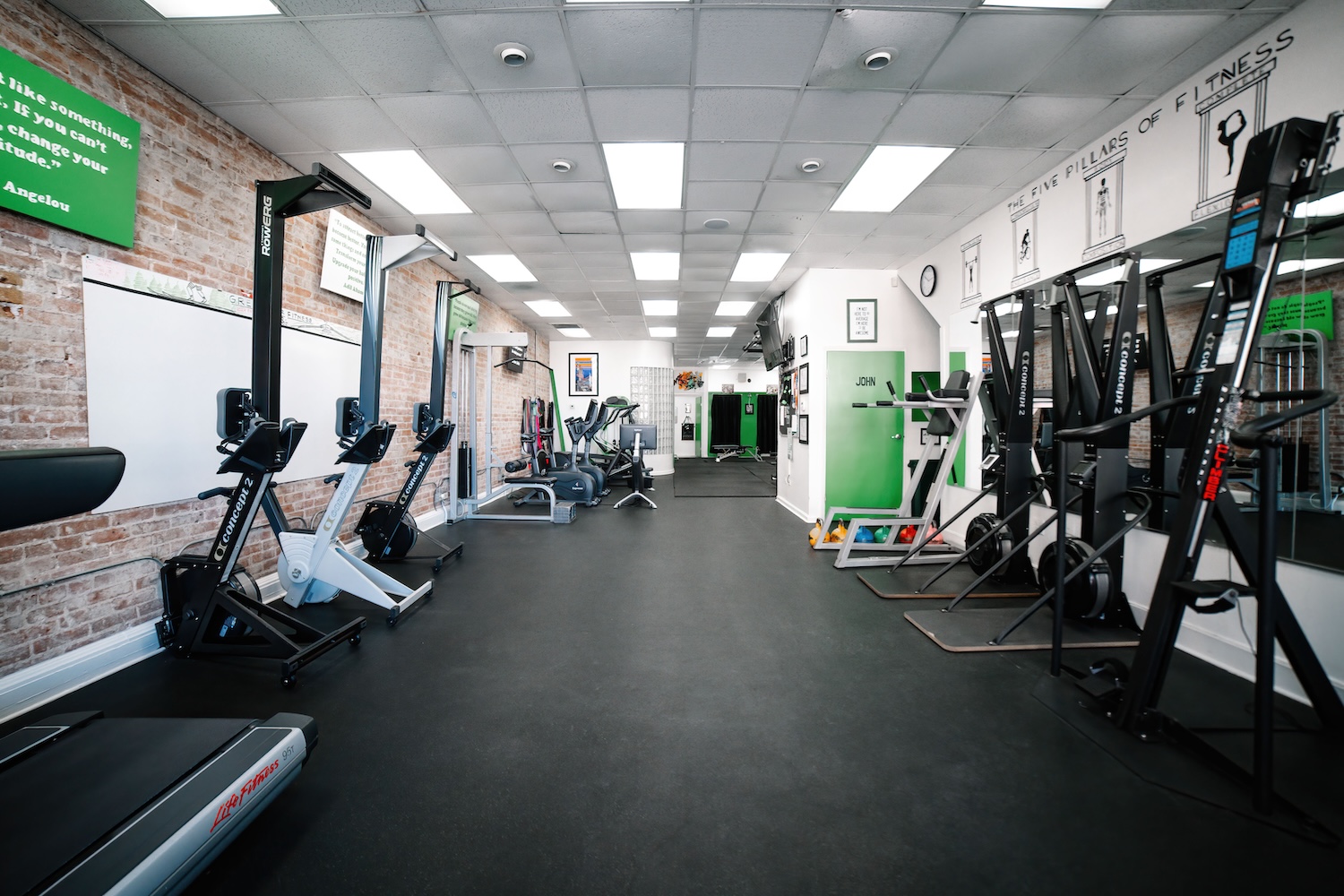 Green Door Fitness gym floor with rowing machines